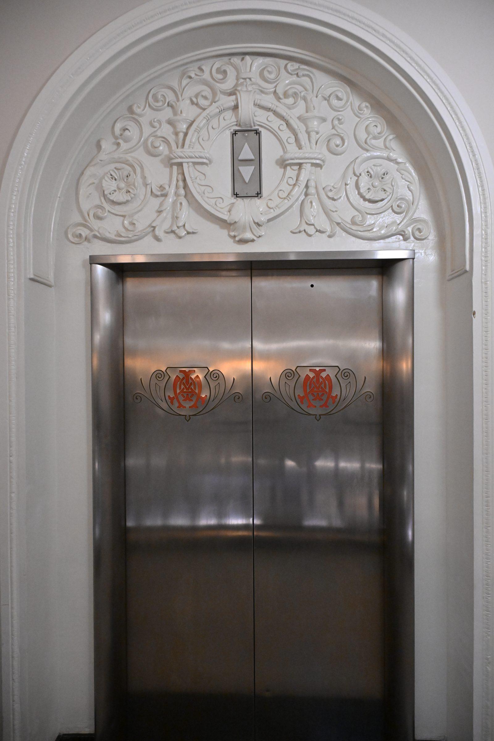 Historic Art Deco elevator entrance inside The Mayo Hotel