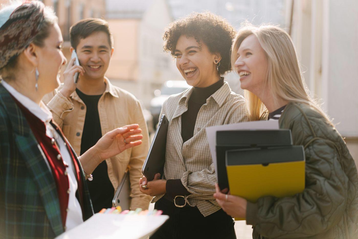 A group of colleagues laughing together